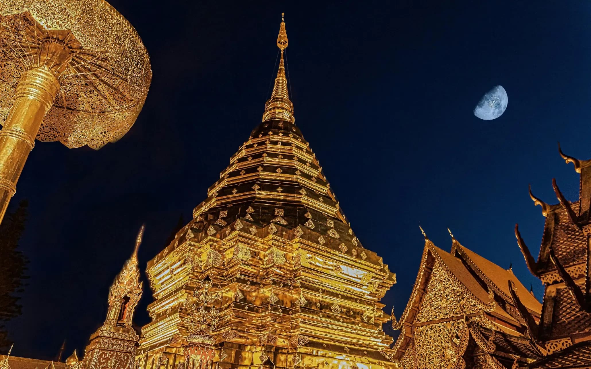 Wat Phra That Doi Suthep at night in Chiang Mai Thailand. Iconic filming location with golden temple architecture for film production and video shoots.
